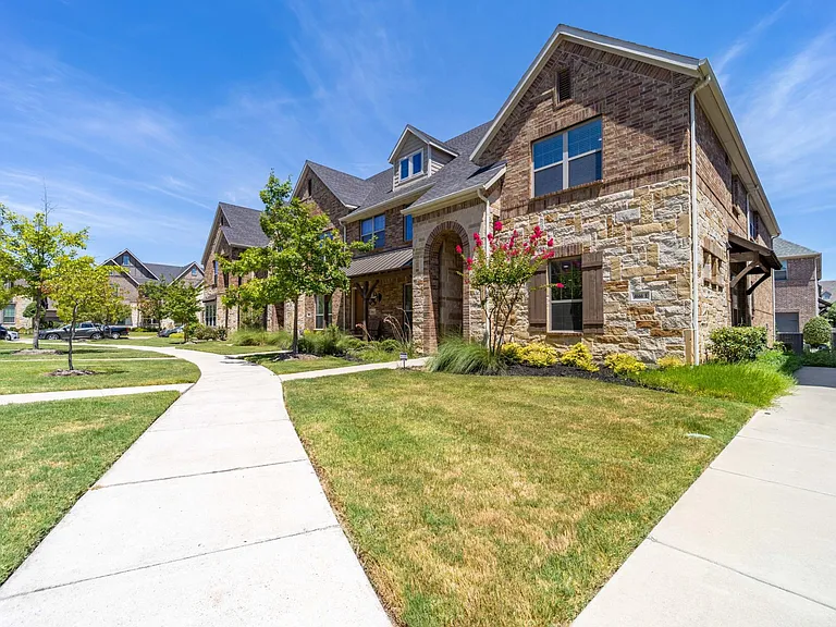 This community is a wonderful place to call home - garage parking with electric car charging station located behind the unit