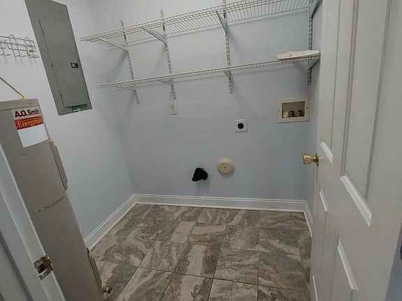 Laundry room and boiler pictured.