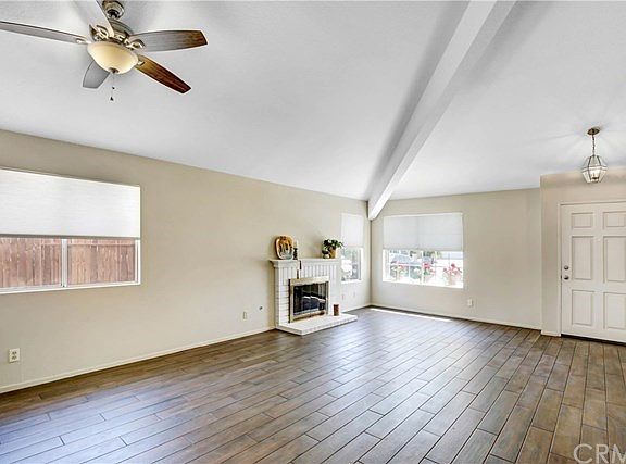 Beautiful entry and living area with high pitched vaulted ceilings