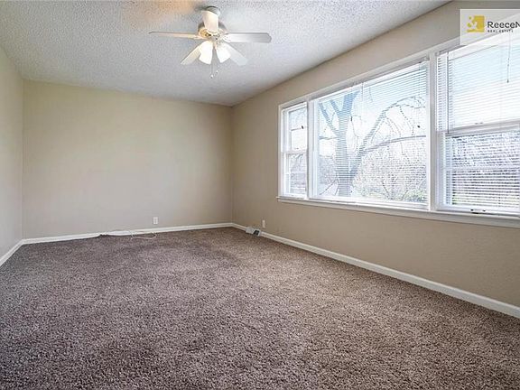 Living room with new carpet and windows