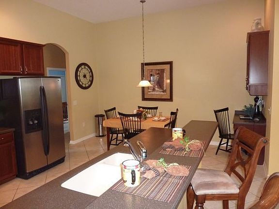 Large eat-in kitchen also has a breakfast bar and kitchen desk.