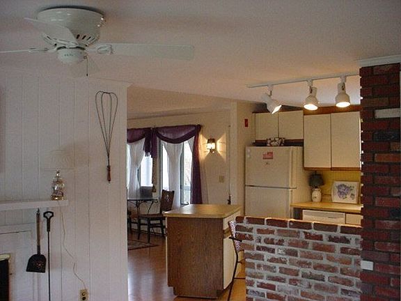 view of kitchen w/moveable center island and breakfast bar