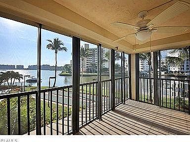 Pic of the main Lanai - Pre-remodel. Only changes needed were installing a new ceiling fan, re-grouting the tile floor and fresh paint. All completed! Furnished with a 5 person patio set and 2 small end tables and 2 upholstered chairs.