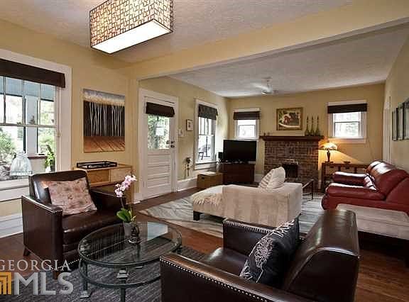 Wonderful and Large living room / dining room combo is great for entertaining and flooded with natur