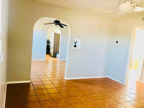 Living room looking into dining area. Nest thermostat very efficiently heats and cools, and ceiling fans in every room keep the air moving.