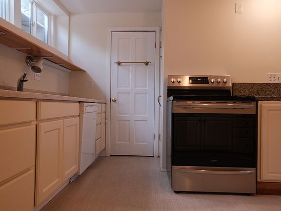 Kitchen with south-facing windows and pantry.