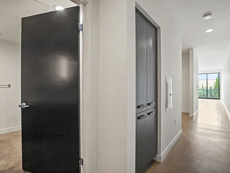 Open-Concept Floor Plan with Hall Storage Cabinets and Bathroom