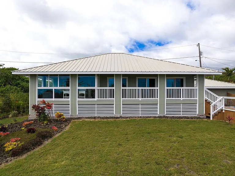 Back of house has a full deck and lanai for you to enjoy island living at its best!