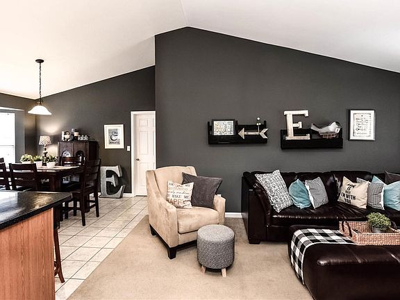 Love this open floor plan with neutral carpet and tile