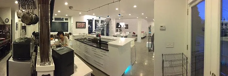 "Back of house": commercial gas cooking with Wolf Range and stainless counters/sinks