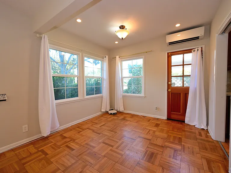 fully upgraded and bright w/ parquet hardwood flooring + mini split hvac + in-unit laundry