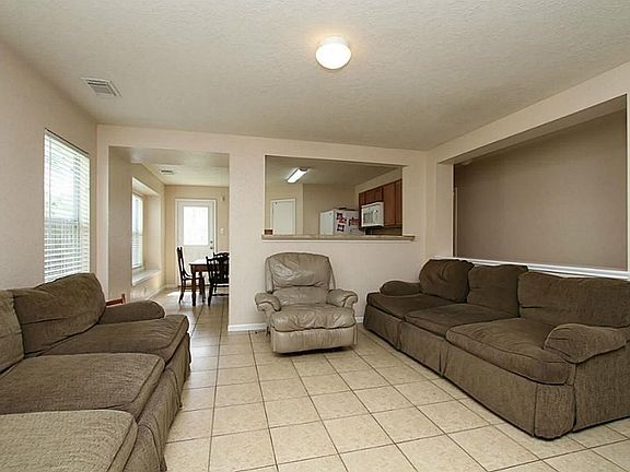 Living area and Breakfast bar area. This is view from entering the front door