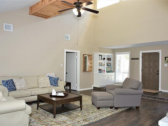 Built in solid wood cabinetry, sunken living room. Door allows for bedroom area to be closed off.