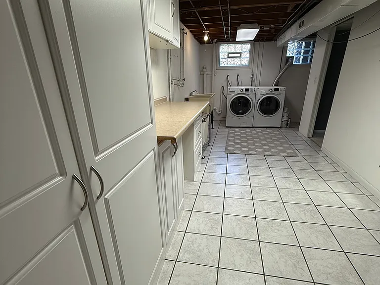 laundry room with plenty of storage