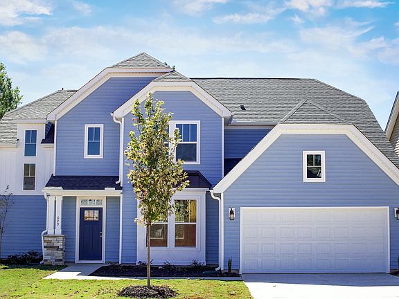 2 story single-family home, blue with a 2 car garage