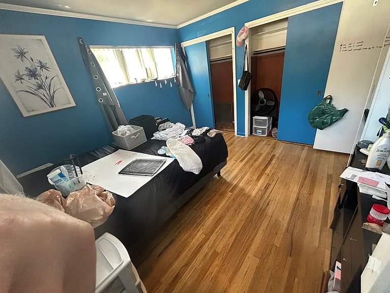 Bedroom #2, large room with 2 double closets with lights (bed in the room is queen sized and has walking room on both sides plus plenty of extra floor space)