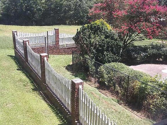 Fenced in area LH side home 