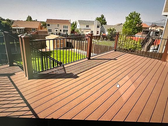 Trex rear deck, storage shed.