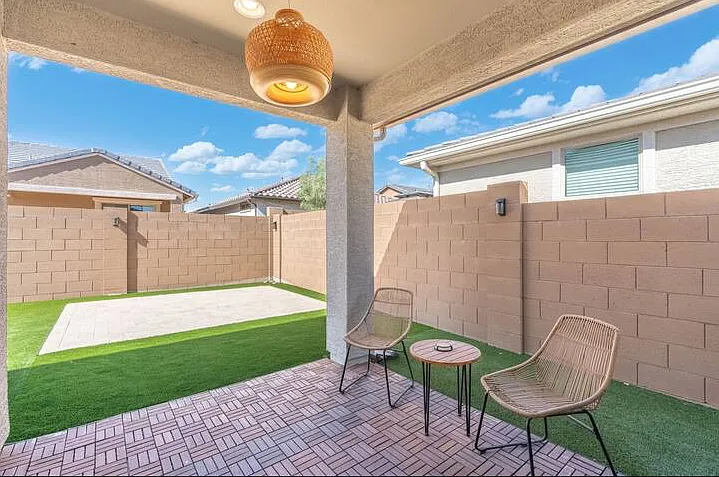 Private backyard with patio seating_perfect for morning coffee or evening relaxation.