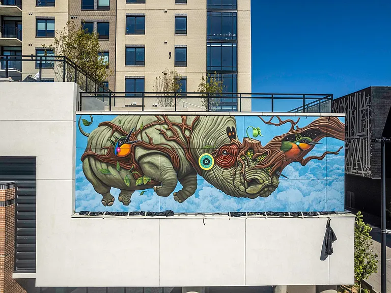 Striking outdoor mural enhances the vibrant, artistic character of the community.