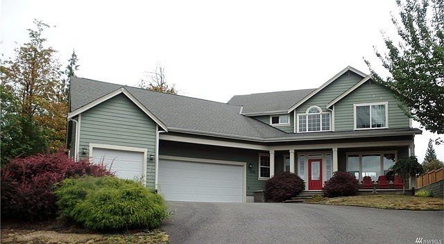 Sitting pretty on a large half acre lot with private rear yard and 3 car garage.