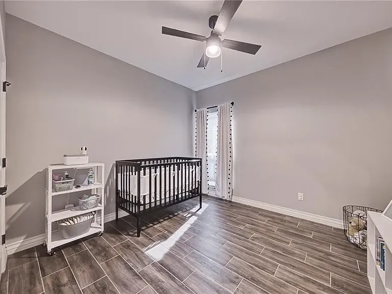 Guest Bedroom 1 with a functional layout and closet for additional storage.