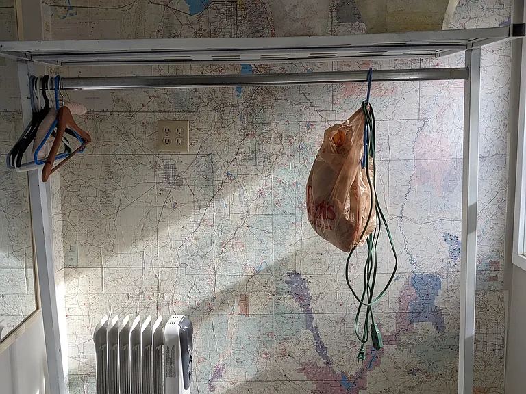 Hanging storage and external closet included. a full sized map of utah as reading material