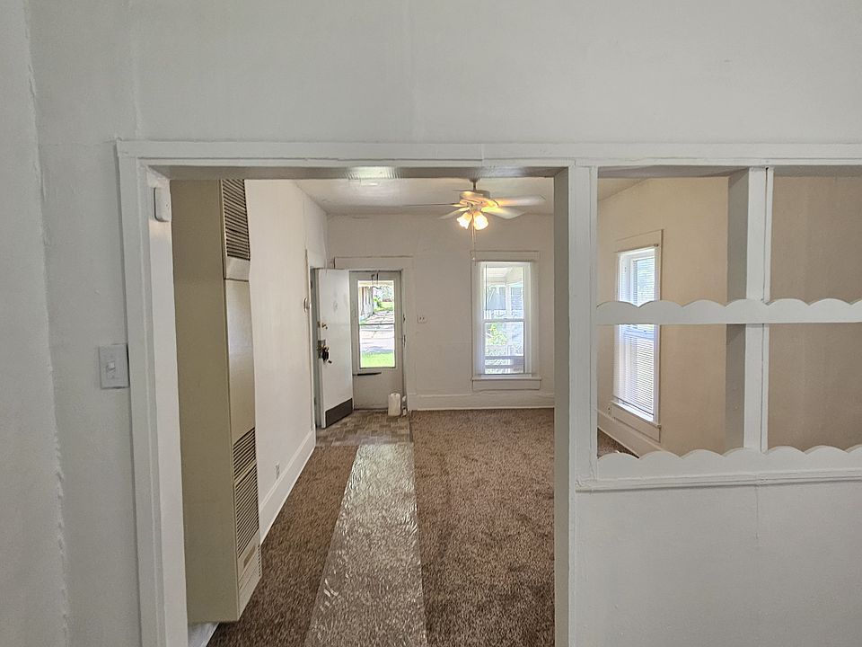 View from dining room area, looking toward front door into living room