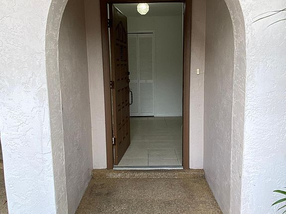 The front entry that gets you out of the weather and then the doorway into the home. Directly ahead is a coat closet.