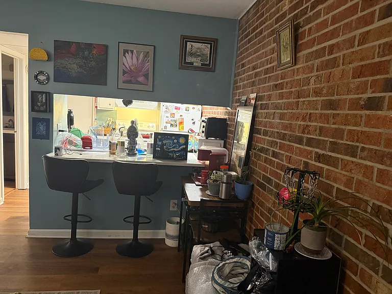 Front door opens into dining area, with cut out into the kitchen