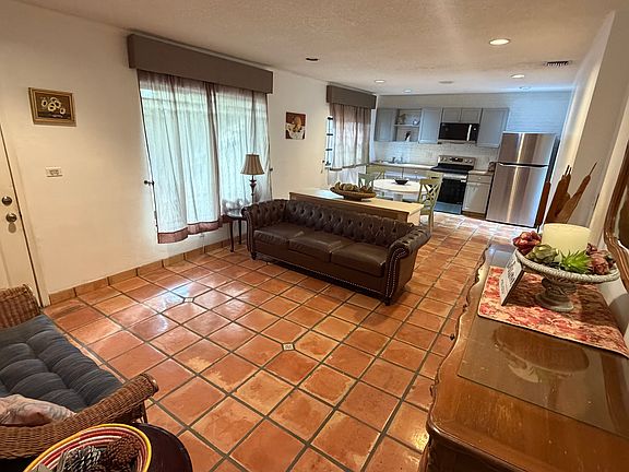 Full view of living, dining and kitchen space.