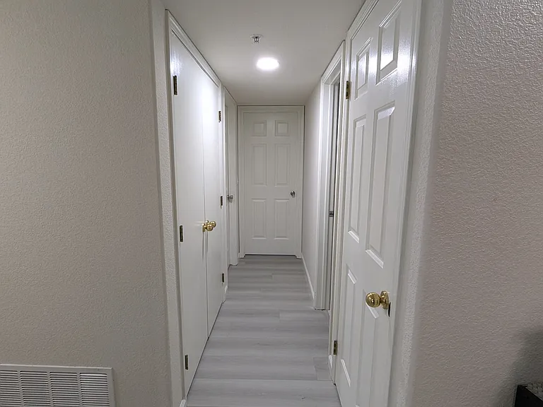 Hallway to guest bedrooms and guest bathroom
