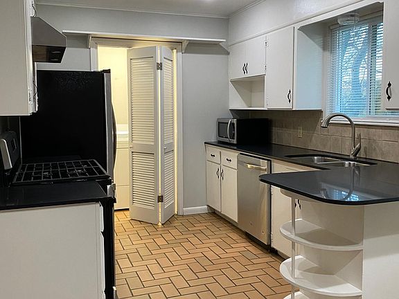 Kitchen with New Countertops - Entry to Pantry and Laundry