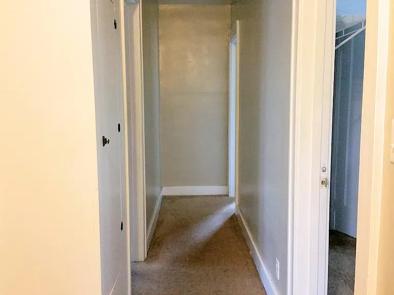 Hallway to each of the 3 bedrooms and kitchen