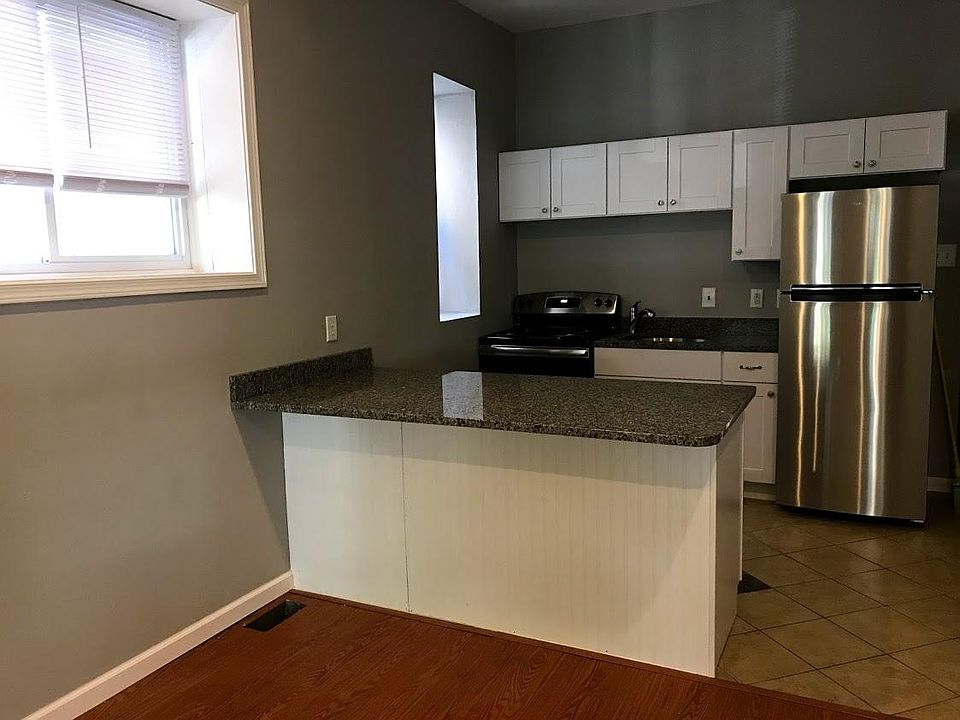 New kitchen with granite counters, stainless appliances, garbage disposal.
