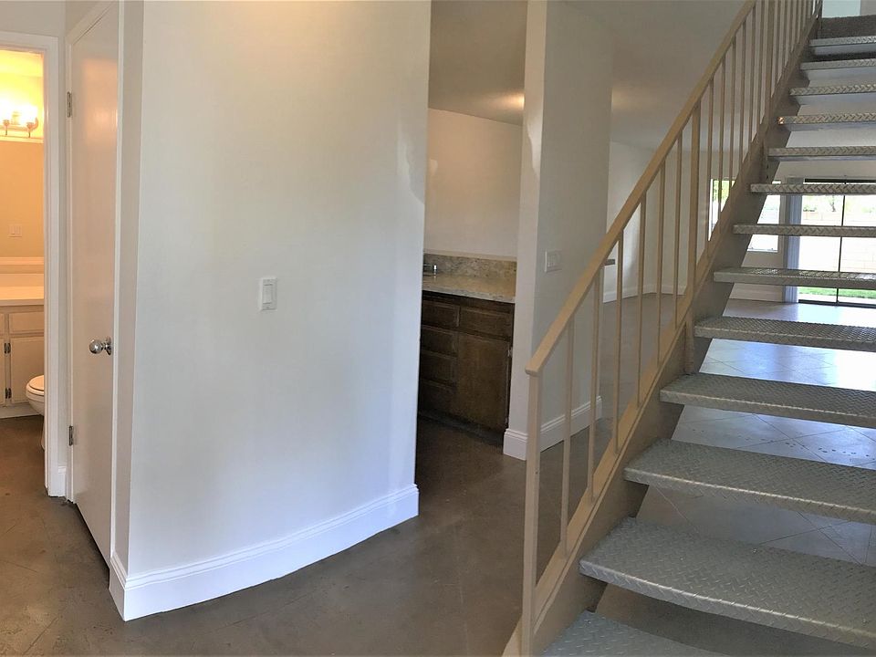 Just inside the entrance; powder room and hall closet to the left and kitchen/living space to the right.