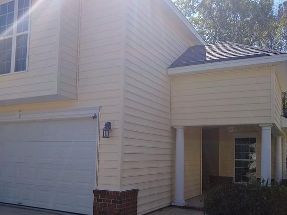 Front entrance with covered patio.