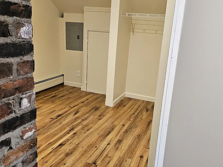 2nd hallway. This is between both bedrooms and the bathroom. It features a small open closet for more storage.
