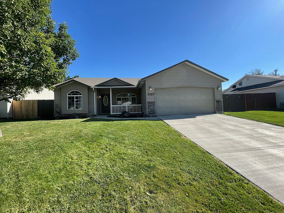 Front of home with nice front yard, driveway and oversized 2-car garage.