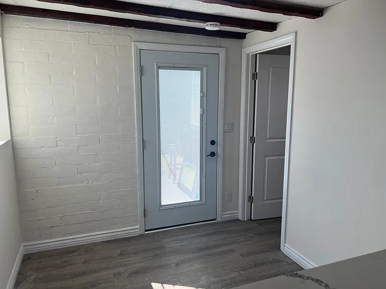 Front door. Blinds can close and let in light.