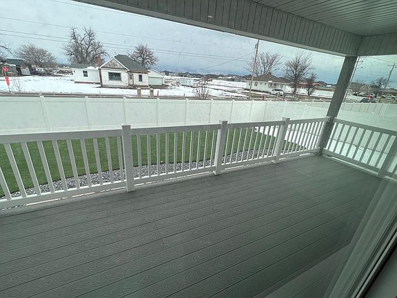 covered deck, fenced yard, always green turf