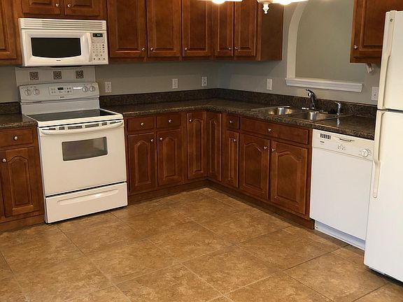 Kitchen includes dishwasher, oven/microwave and refrigerator. Patio and fenced in privacy yard in the back off of the kitchen.