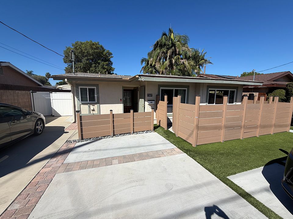 Street view of the front of the house with a view of the front patio.
