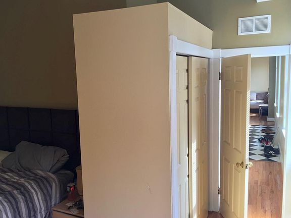 Hall leading from bedroom to living room, with closet