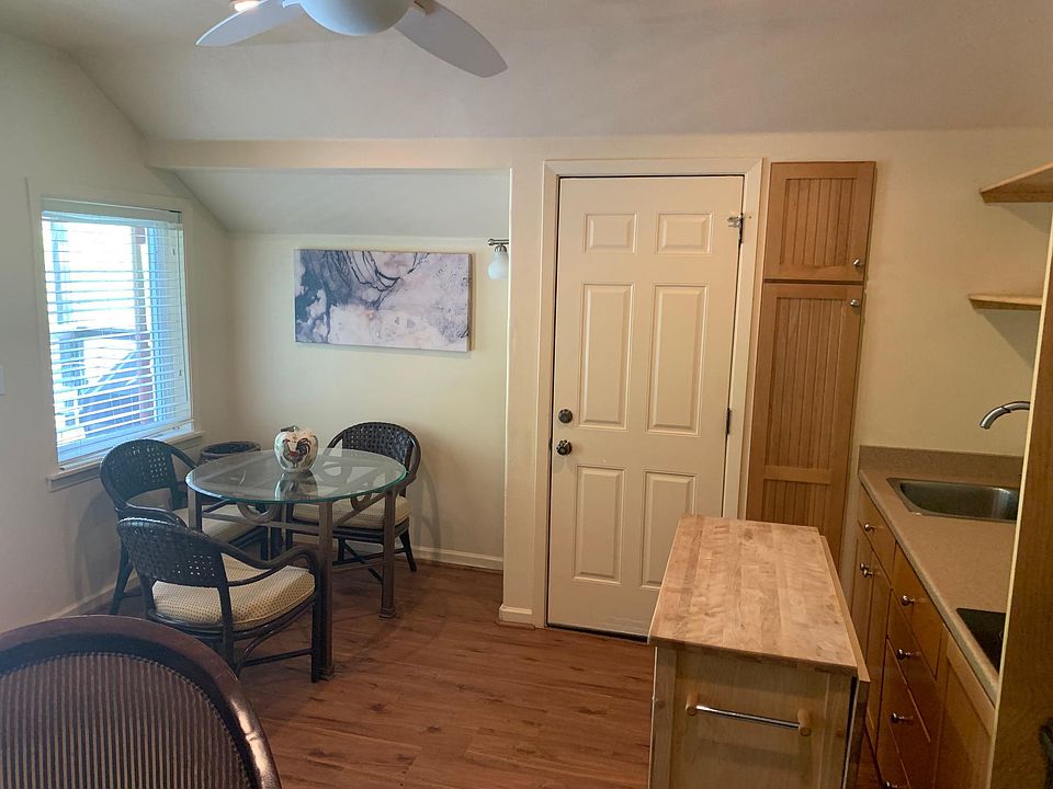 kitchenette area with interior door to the refrigerator on the other side of this door access to the pantry room and sizable carpeted private storage area.
