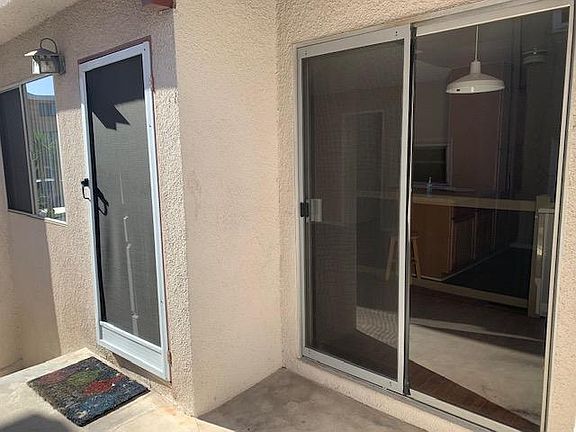 Sliding glass door with small patio area