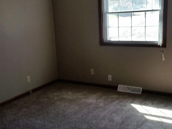 one of two small bedrooms