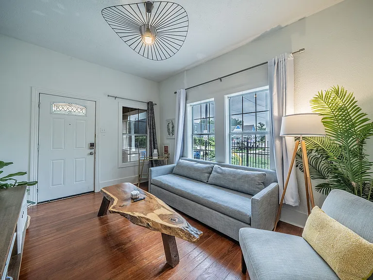 Relax in this bright, airy living room with stylish modern decor.