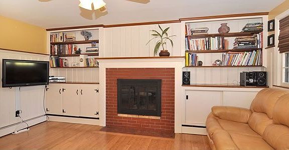 Family Room with Built-In Bookcases and Wood-Burning Fireplace