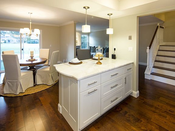 View from Kitchen Area : Dining Room just off kitchen/slider to rear patio w/view of the golf course